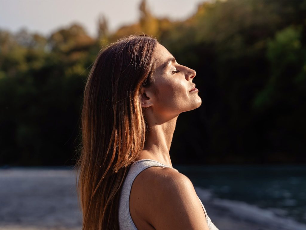 Woman looking into the sun