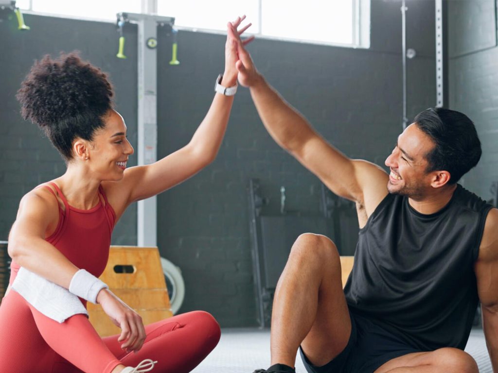 People seated high-fiving