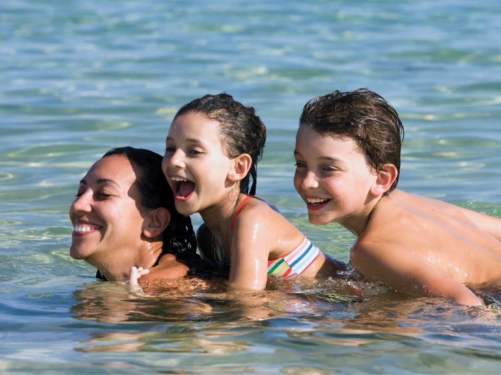 Mum and kids playing in the water