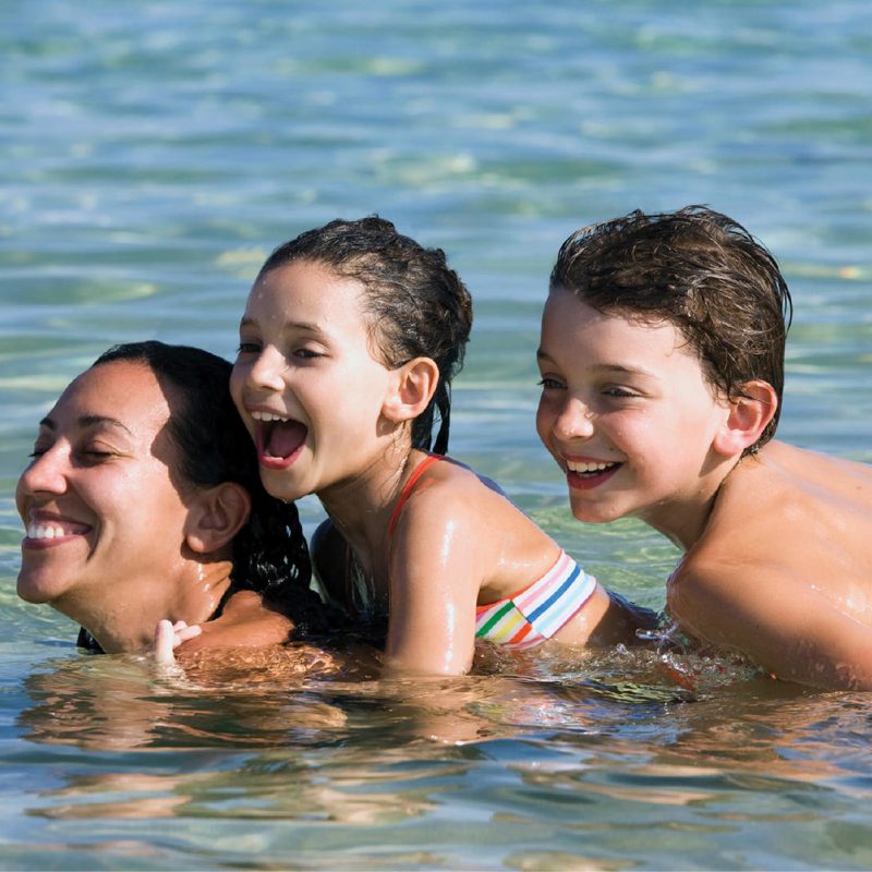 Mum and kids playing in the water