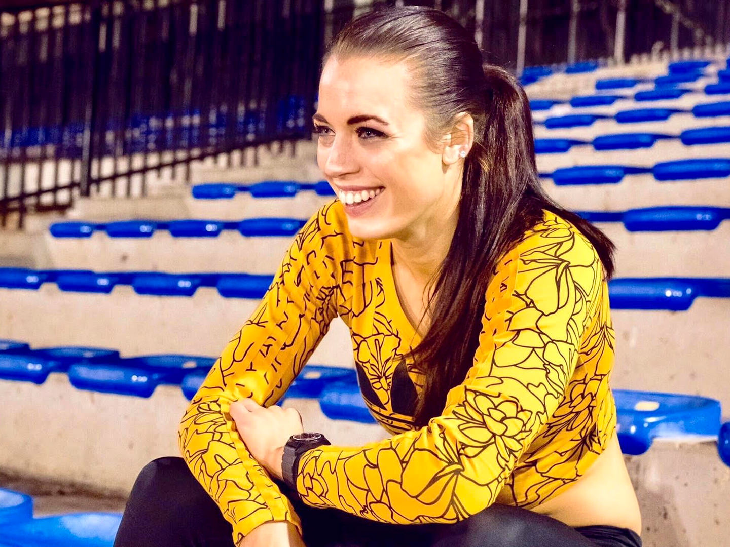 Elana Withnall-Dickson sitting in stadium in training gear