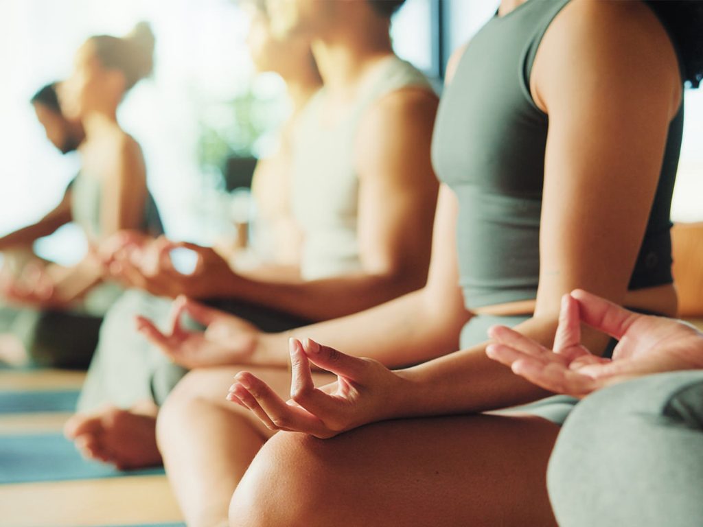 People sitting in lotus pose